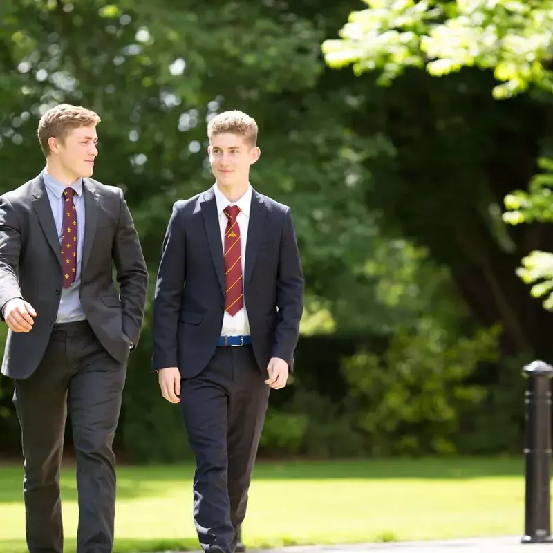 Two boys walking outside Pocklington School 