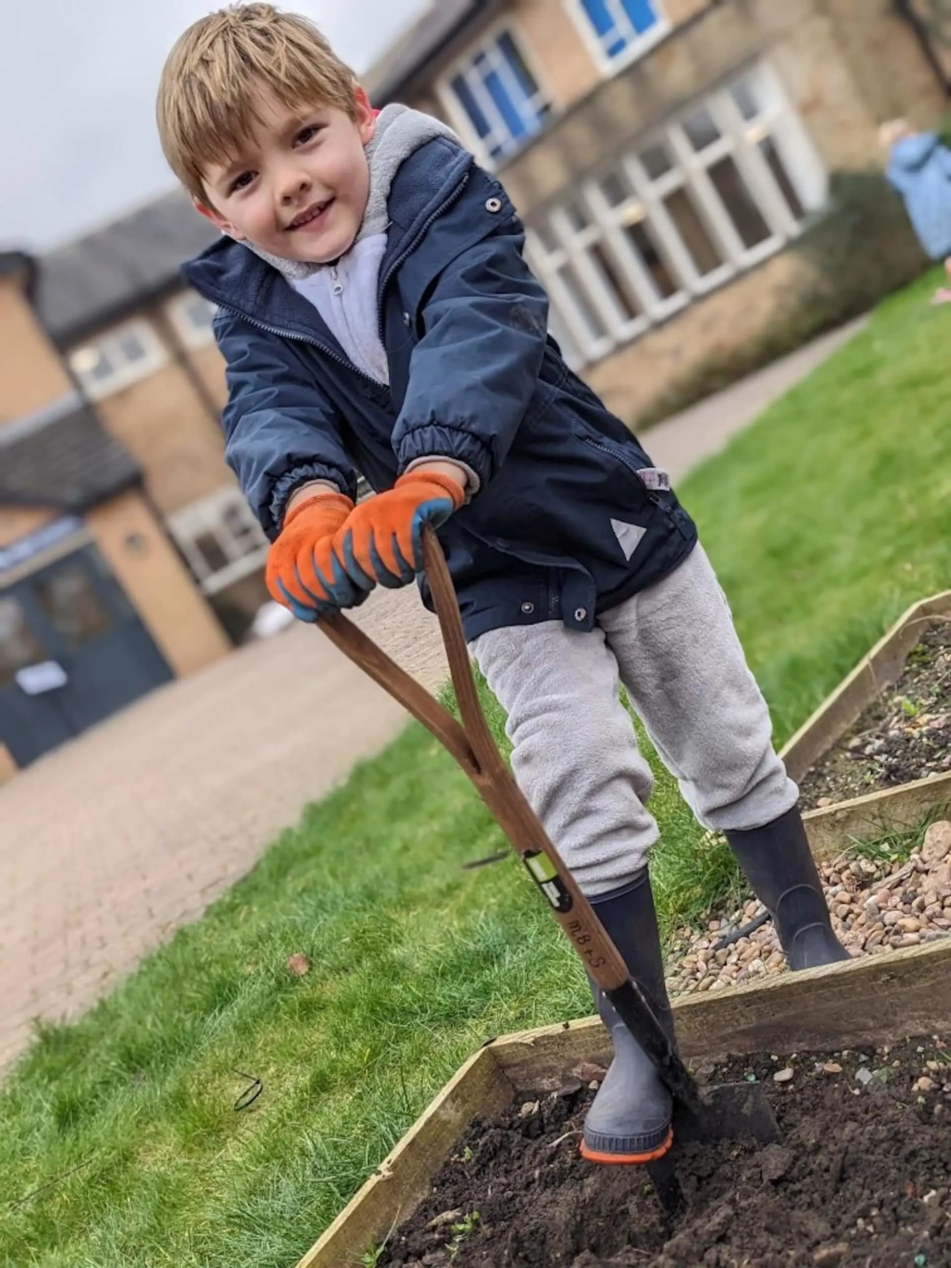 Pocklington Pre-School pupil planting seeds as part of the ‘Mind, Body and Soil’ initiative.