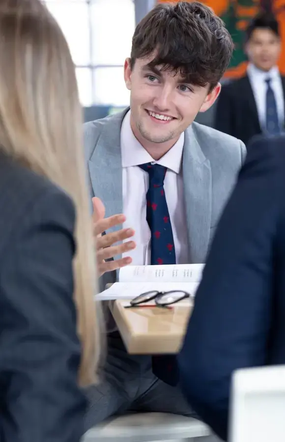 Pocklington School Sixth Formers in psychology class with books