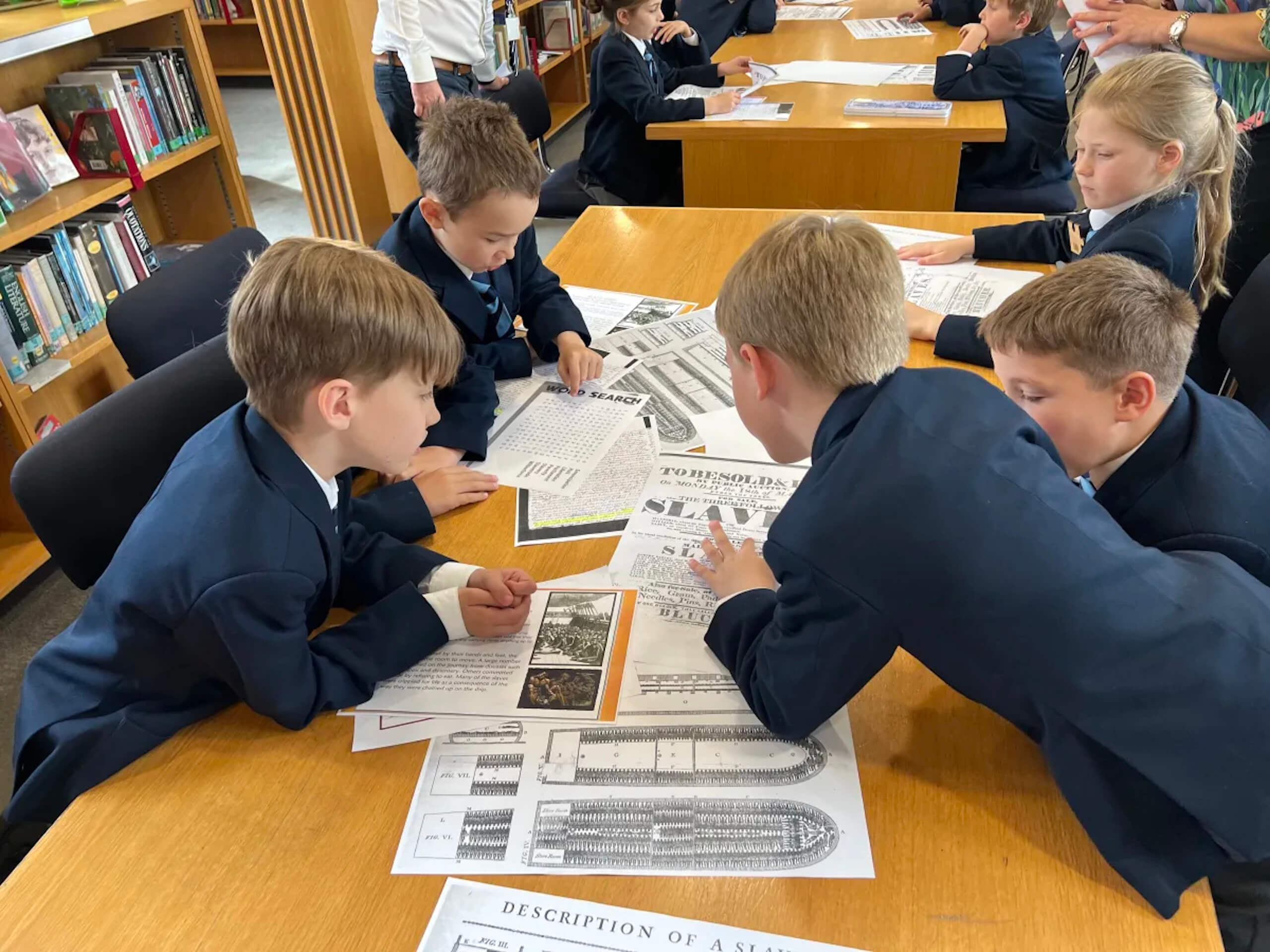 Prep School pupils reading school archive