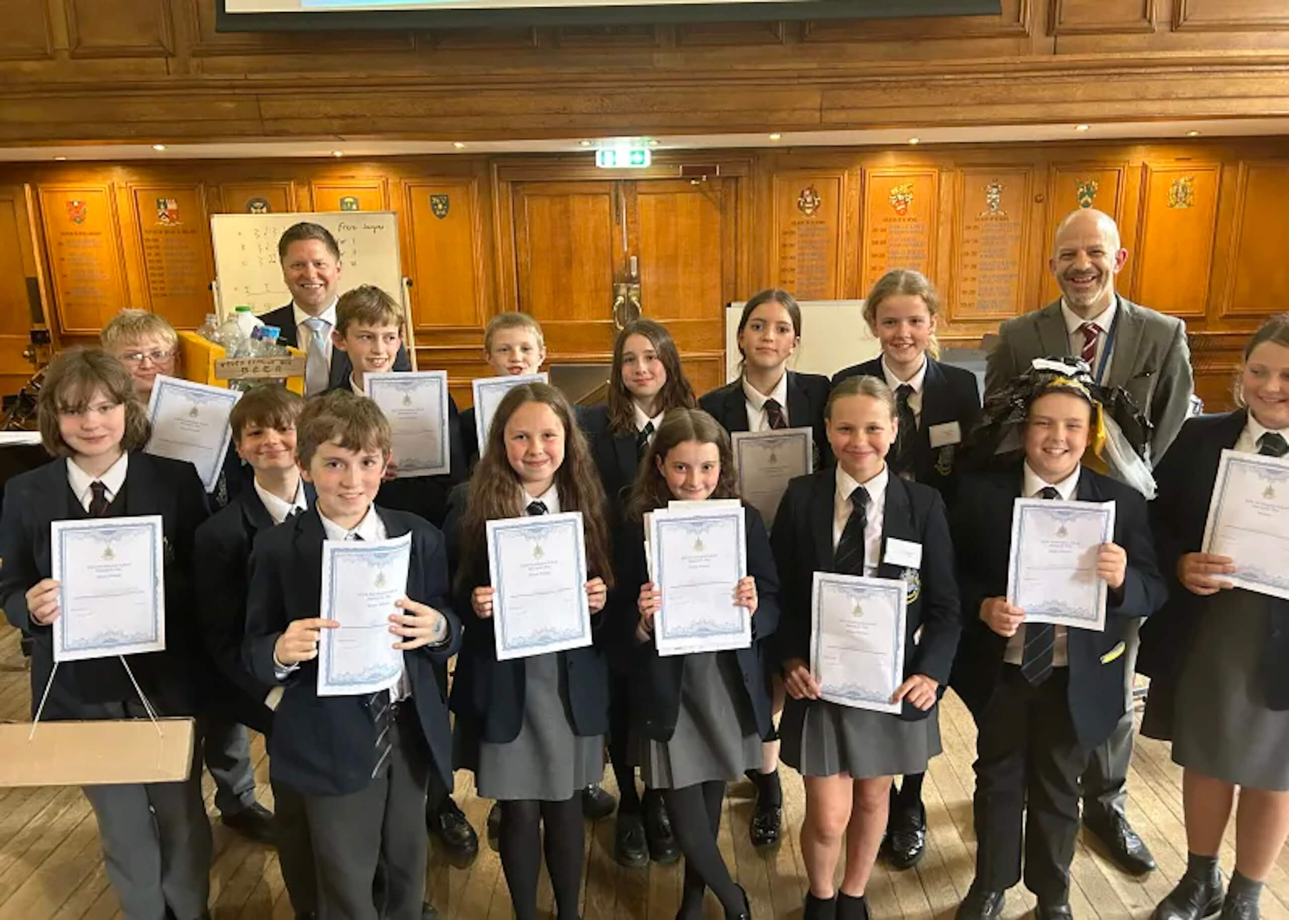 Prep school students holding certificate 