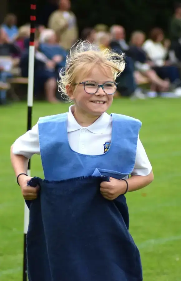 Pocklington Prep school pupils smiling in the sack race at sports day 