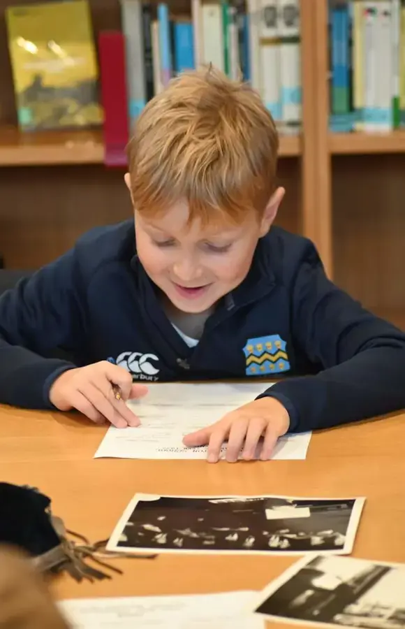 Pocklington Prep School pupil works in the library as part of exploratory session with the archives 