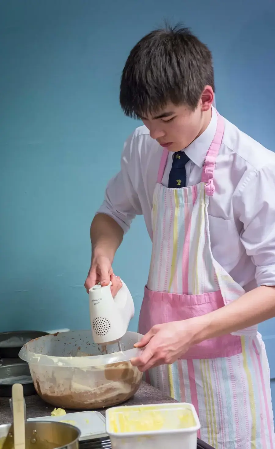 Pocklington School pupil with a mixing bowl in cookery