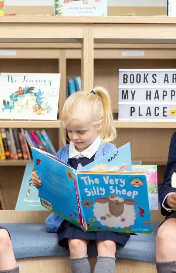 Pocklington School Pre Prep pupils and Prep pupils reading books