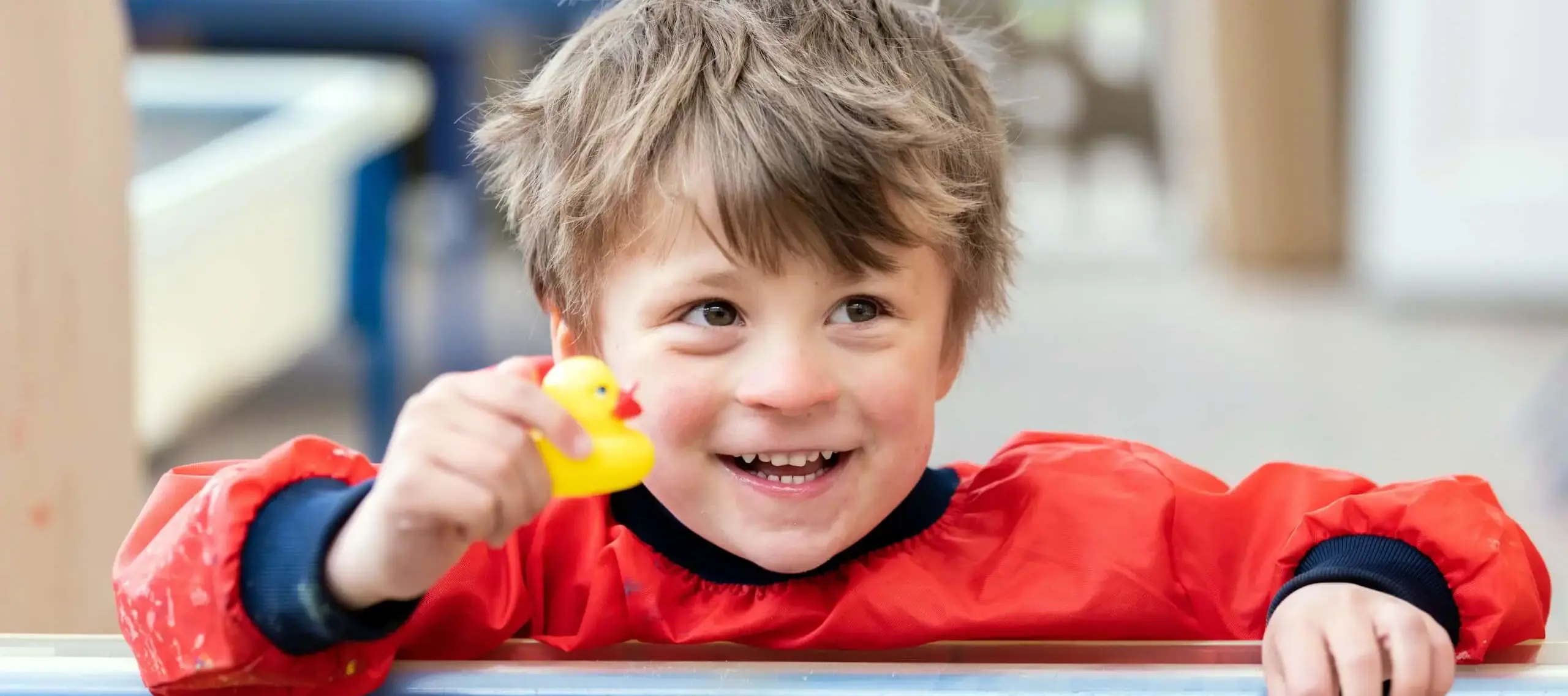 Pocklington Pre Prep pupil playing with a rubber duck 