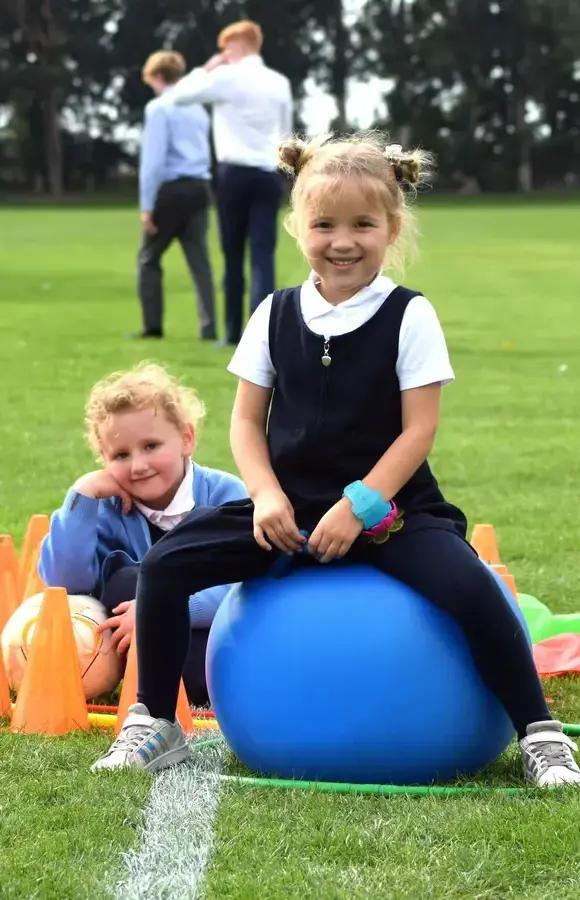 Pocklington Pre-School pupil playing outside on a bouncy hopper 