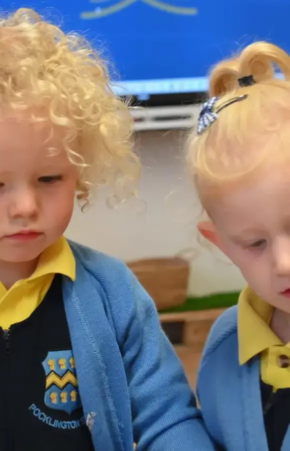 Pre-School Pupils writing with pencils