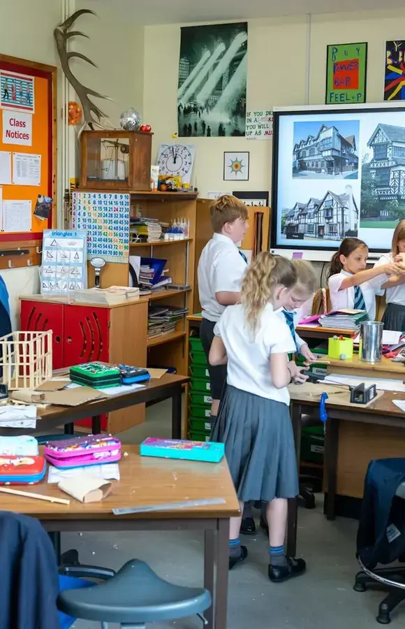 Pocklington Prep school classroom with pupils working on building houses out of lollipop sticks 