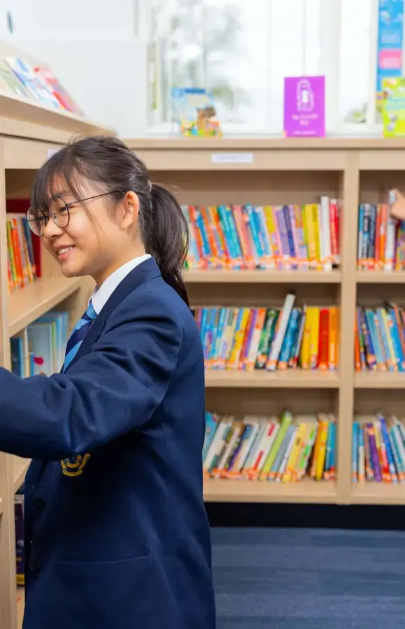 Two Pocklington Prep School pupils enjoy using the library 