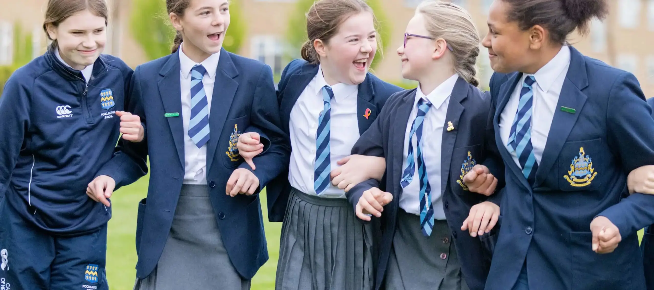 Pocklington Prep School pupils linking arms and laughing 