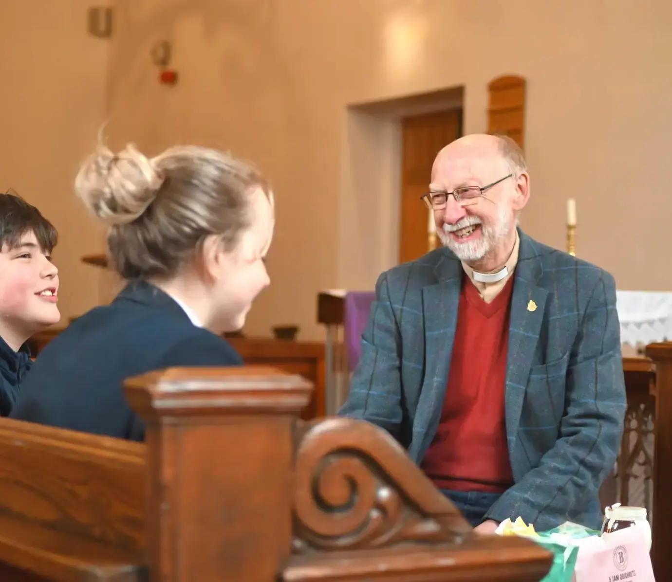 Chaplain at Pocklington School talking to pupils in Chapel