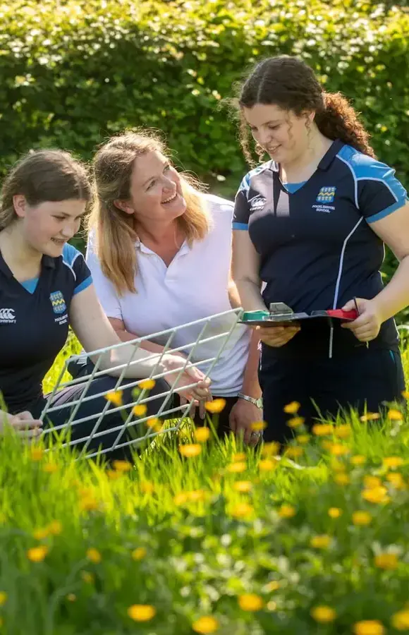 Pocklington School pupil and teacher in biology field area on campus