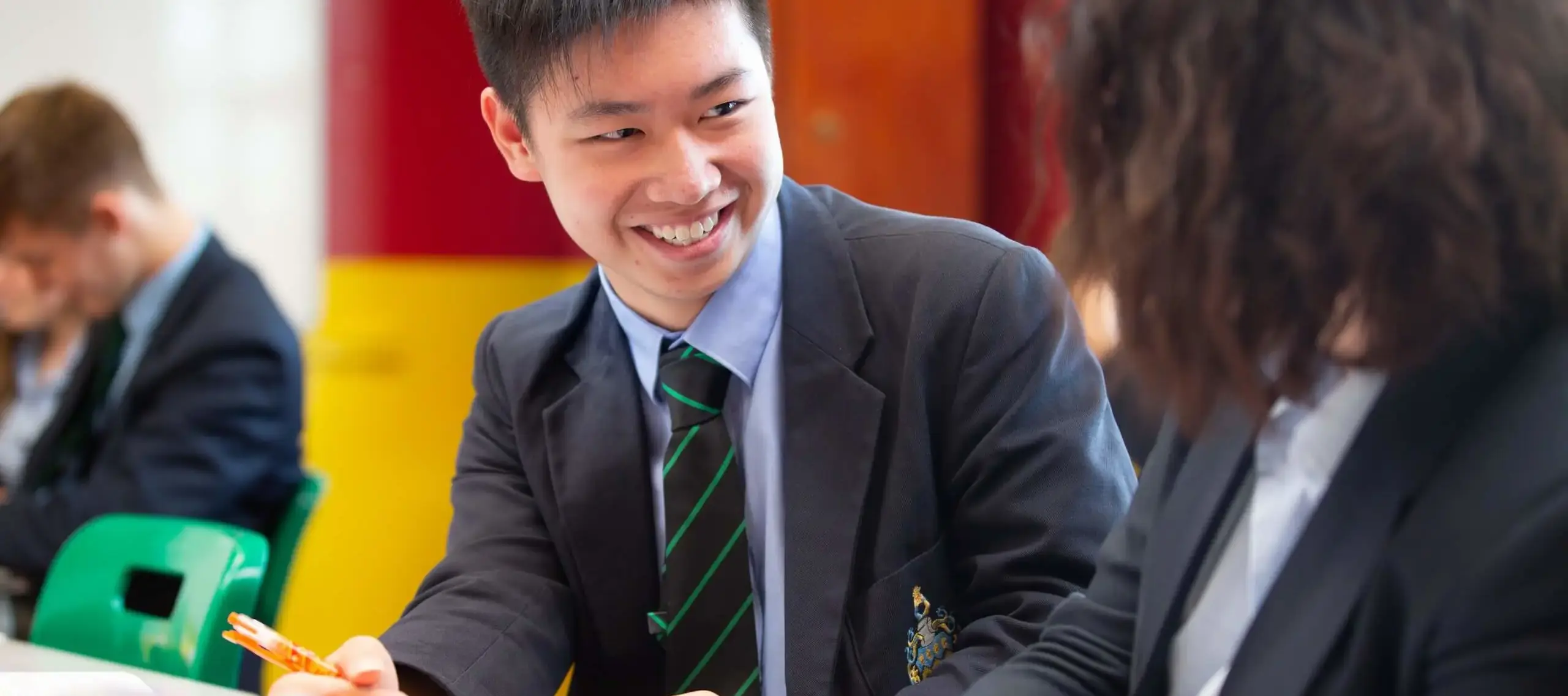 International student at Pocklington School in lesson talking to another student