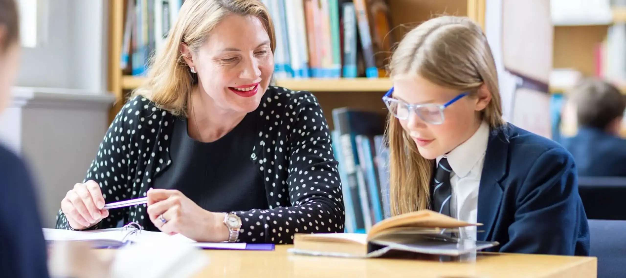 Pocklington Prep School Pupil and teacher work together in the library