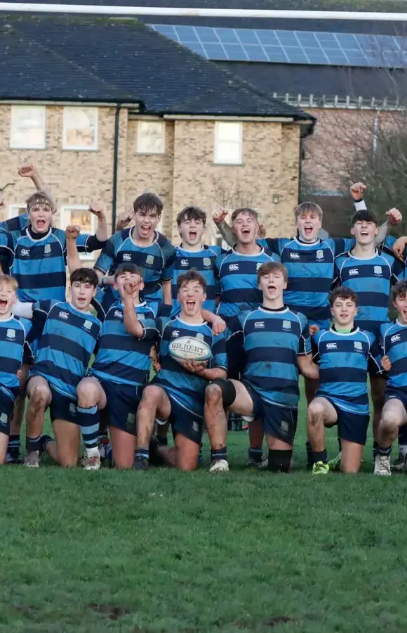 Pocklington School first rugby team in a row celebrating a win