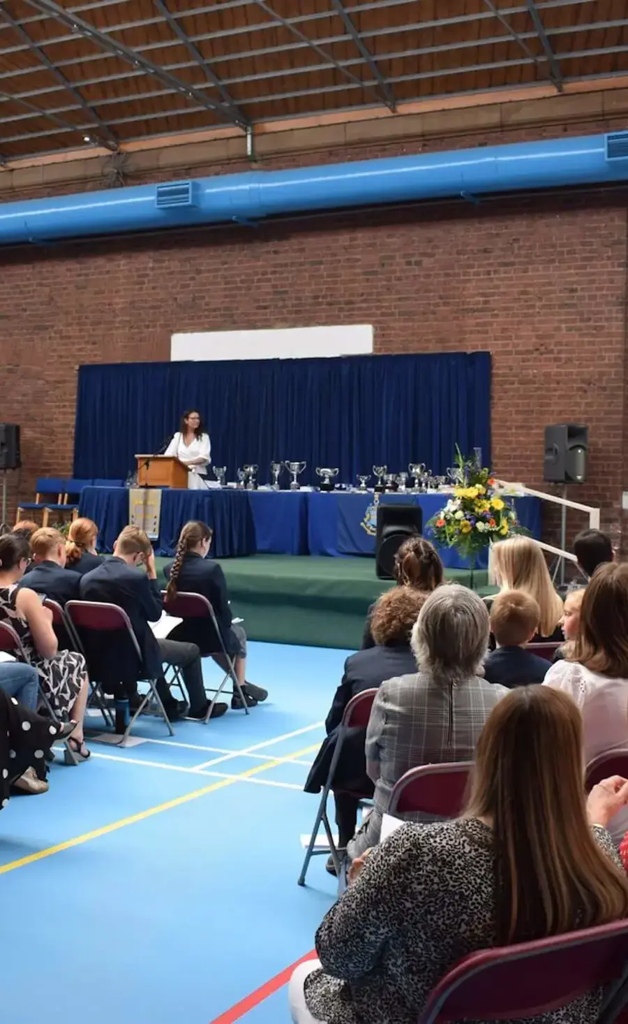 Parents and pupils sit in the audience at Pocklington School Prizegiving ceremony, in the Sports Hall