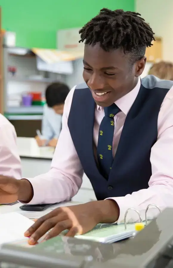 Pocklington School Sixth Former in class with books