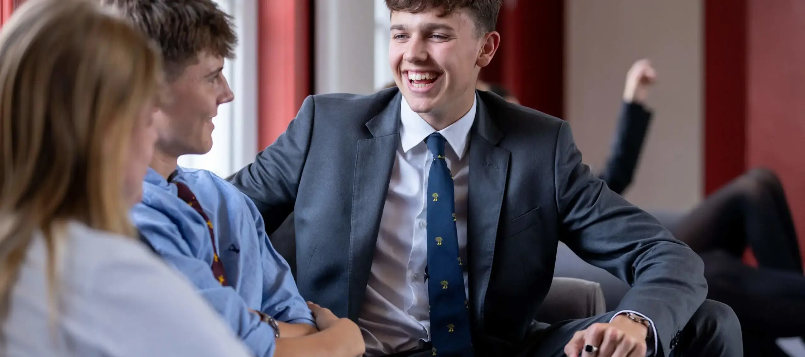 Pocklington School Sixth Form students smiling and chatting to friends