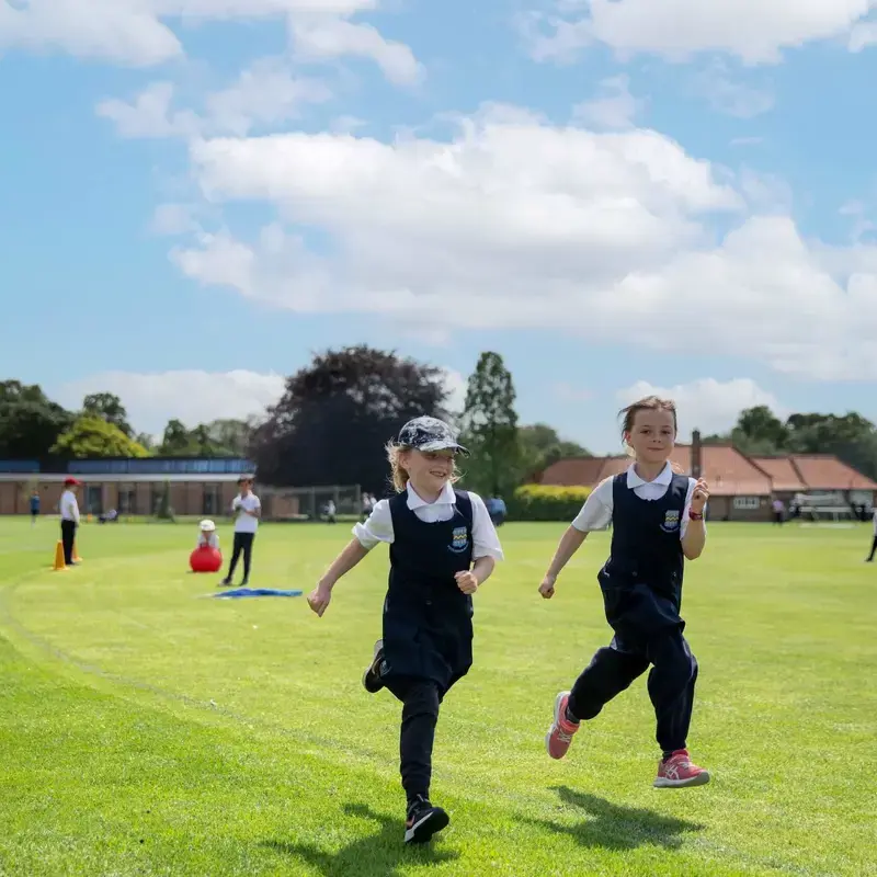 Two Pocklington School children running around the campus.