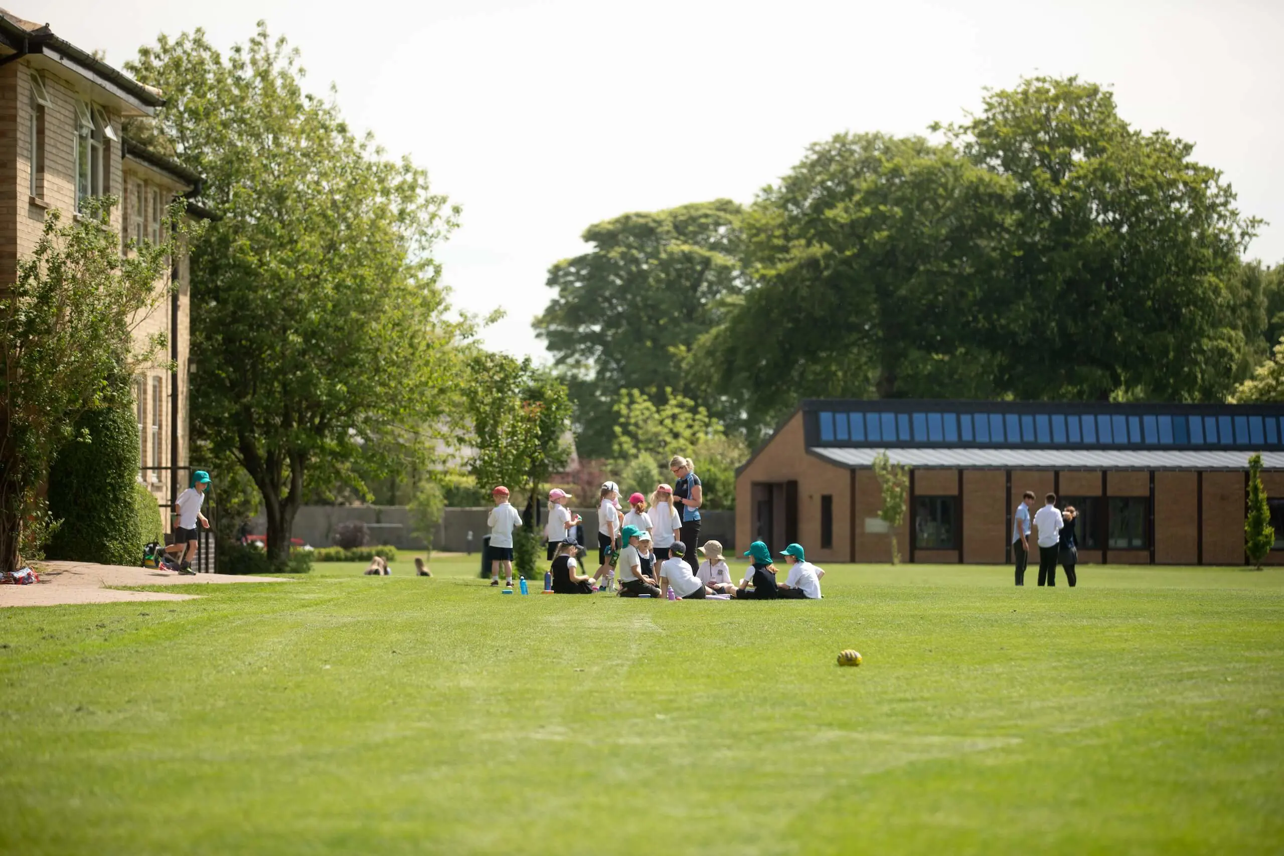 Young Pocklington School pupils gathered around on the grounds outside the Art and Design Centre