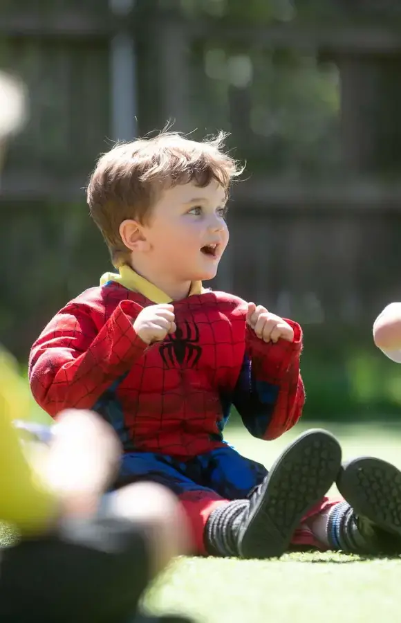 Pocklington Pre-School pupil in spiderman outfit singing