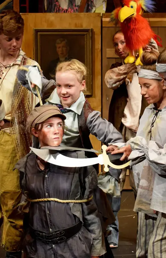 Pocklington School pupils acting on stage in Treasure Island