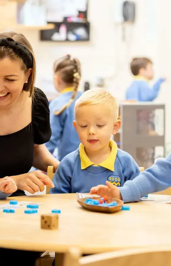 Pre-Prep pupils with teacher playing a counting game