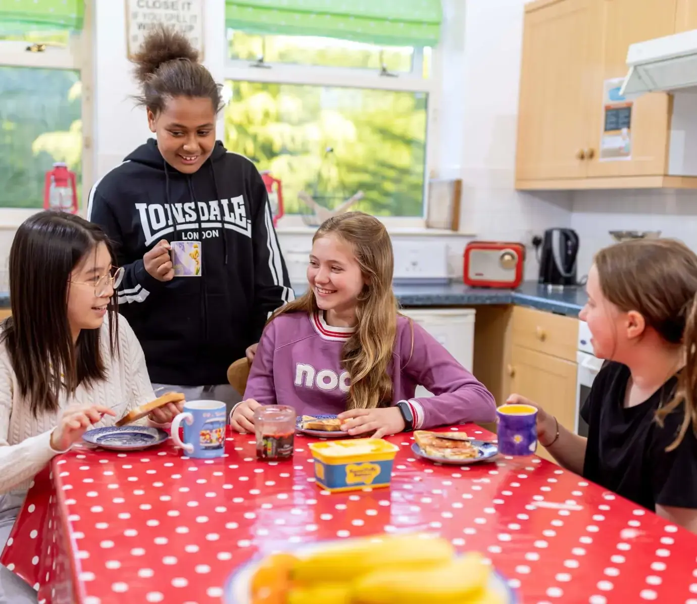 Pocklington School junior boarding pupils socialising in kitchen