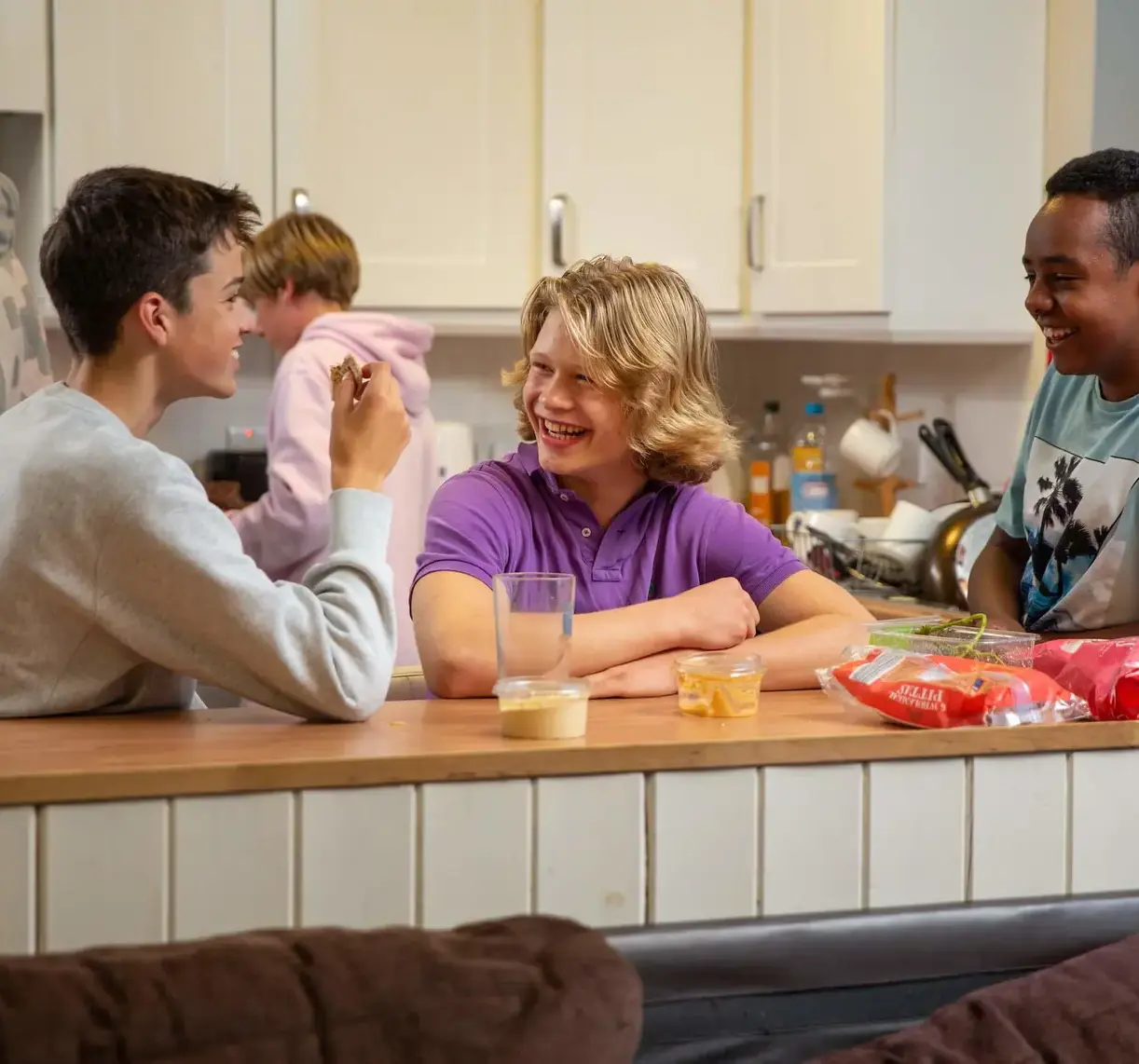 International students laughing in the kitchen