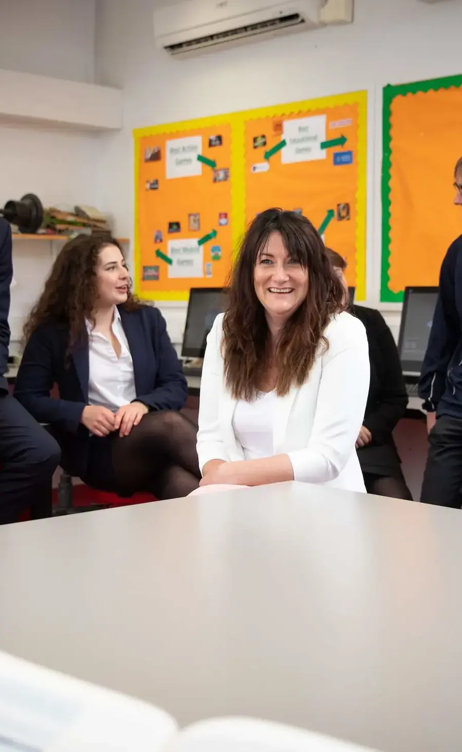 Pocklington School teacher Helen Alexander with Sixth Formers in class