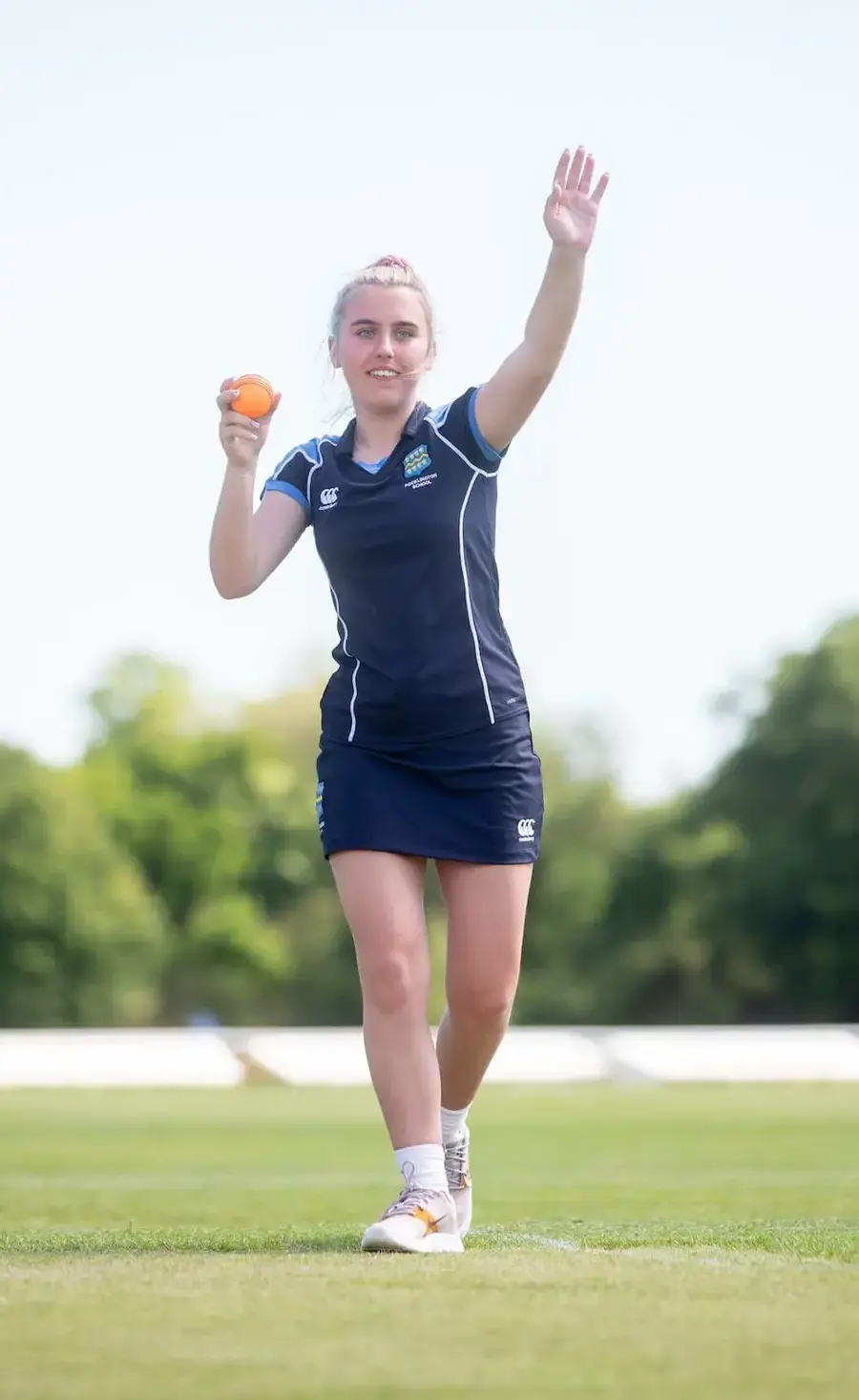 Pocklington School pupil bowling a cricket ball