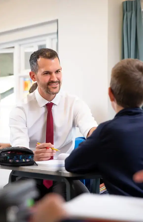 Pocklington School pupil and maths teacher in class