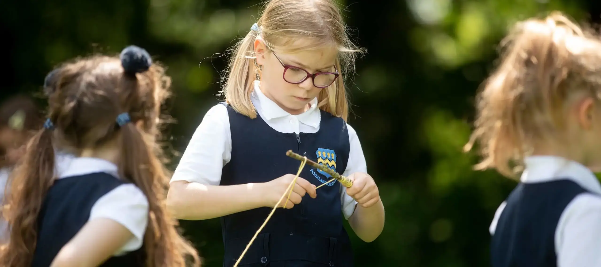 Pre-Prep pupil crafting in forest School