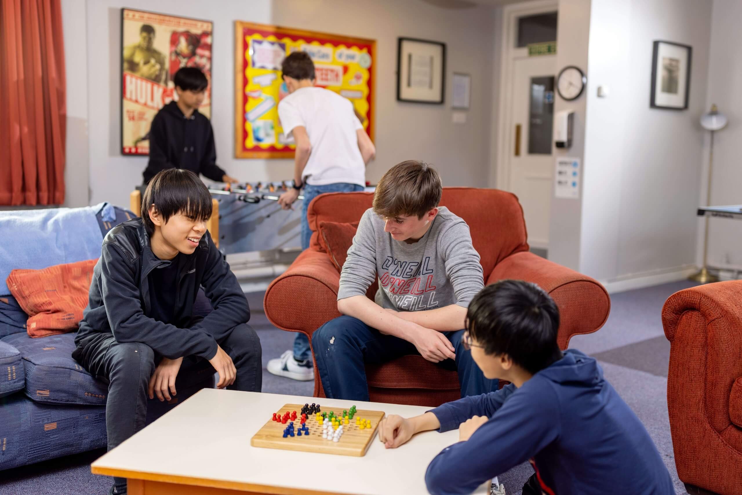 Boarders in common room playing board games