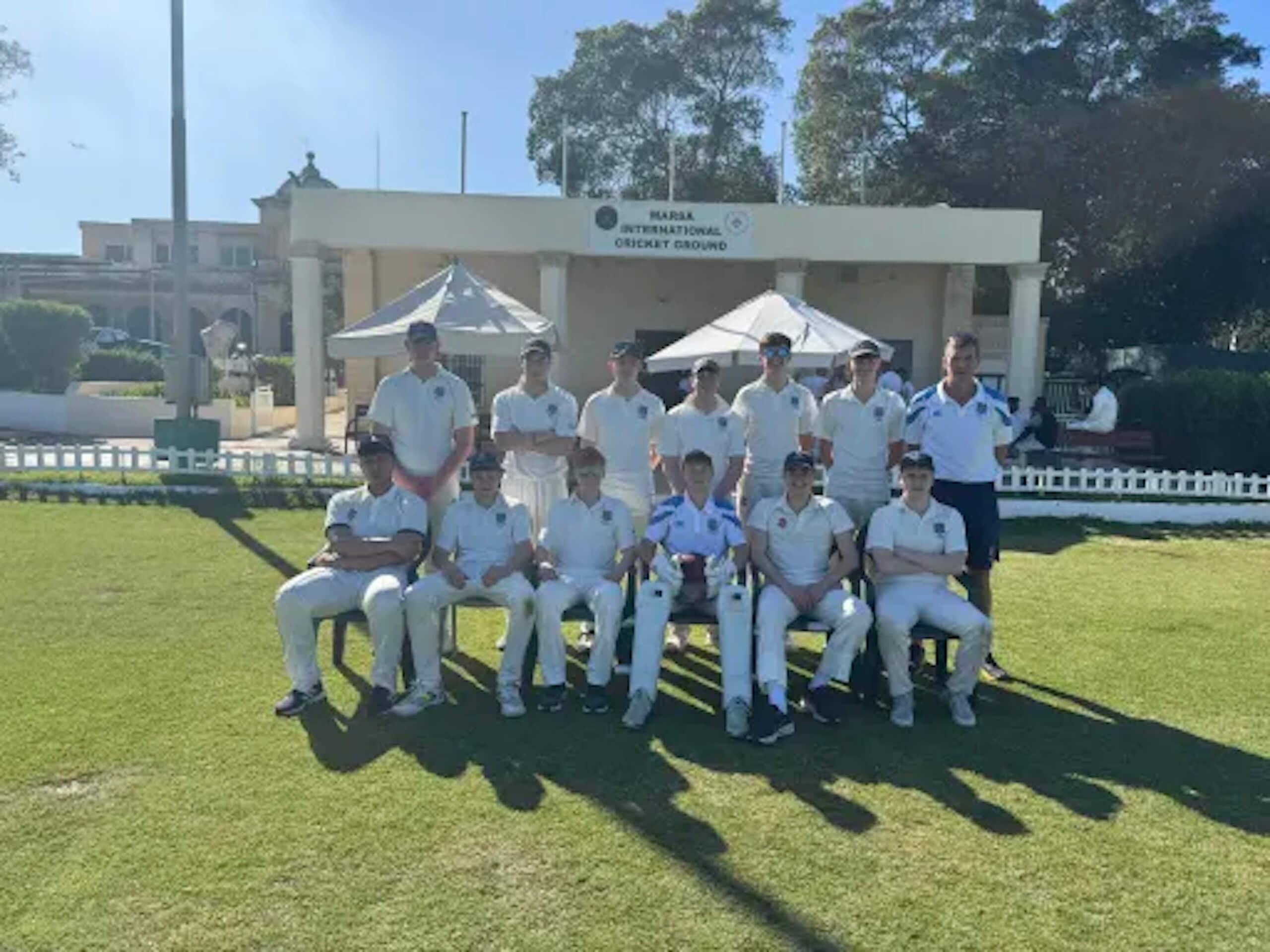 Group of students in cricket uniform