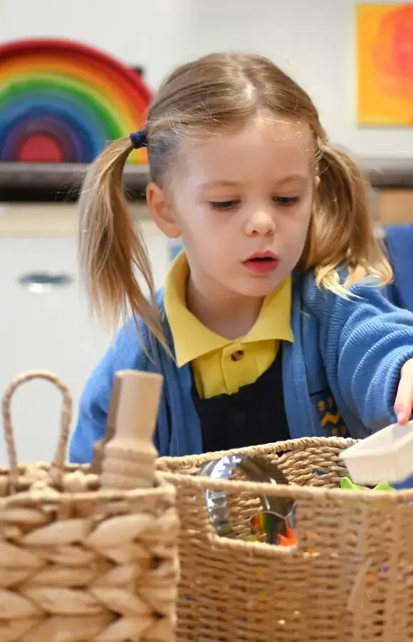 Pre-School pupil playing with cookie cutters