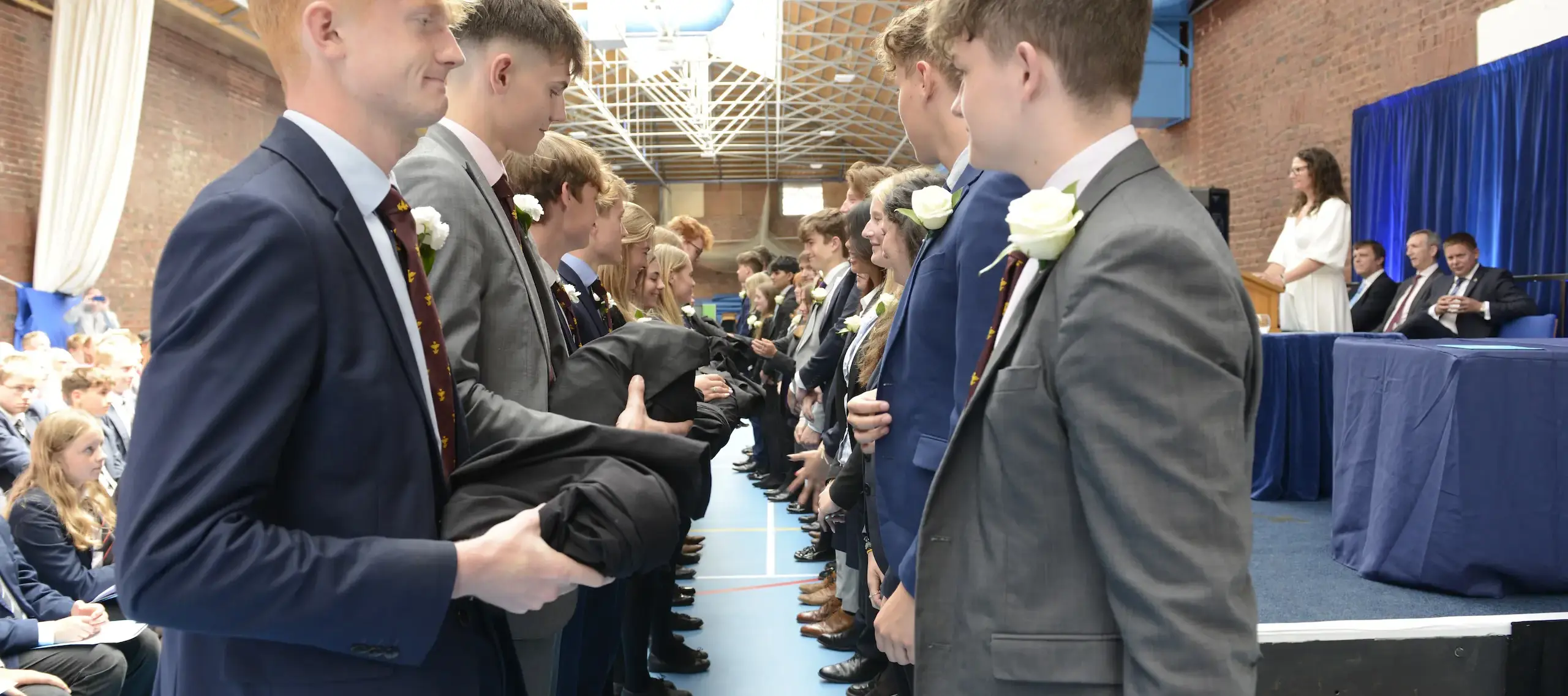 Pocklington School Sixth Form prefects handing over gowns at 