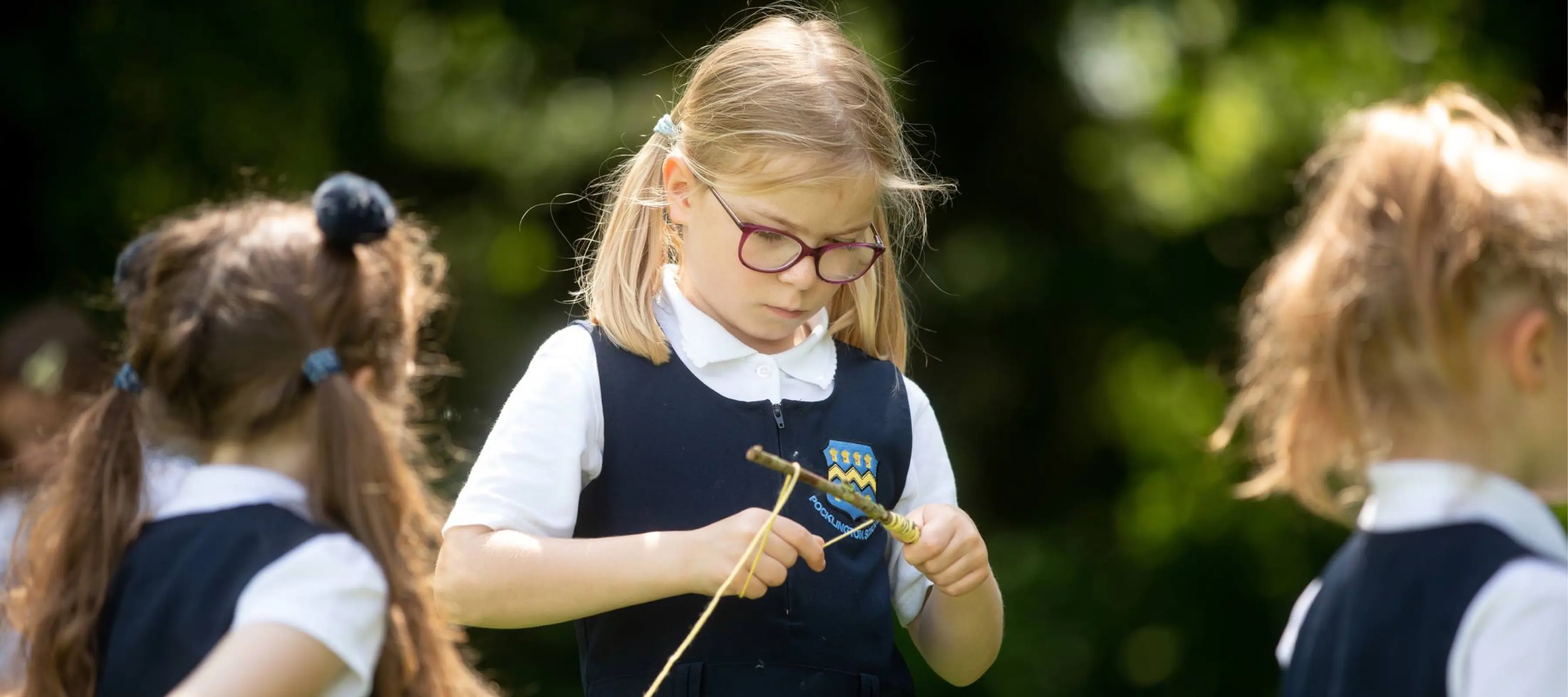 Pre-Prep pupil crafting in forest School