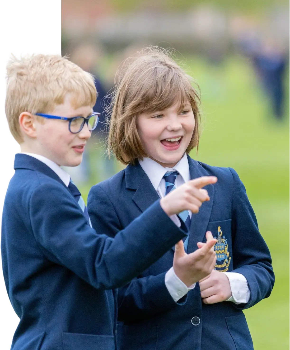 Pocklington Prep school boy and girl at breaktime outside smiling