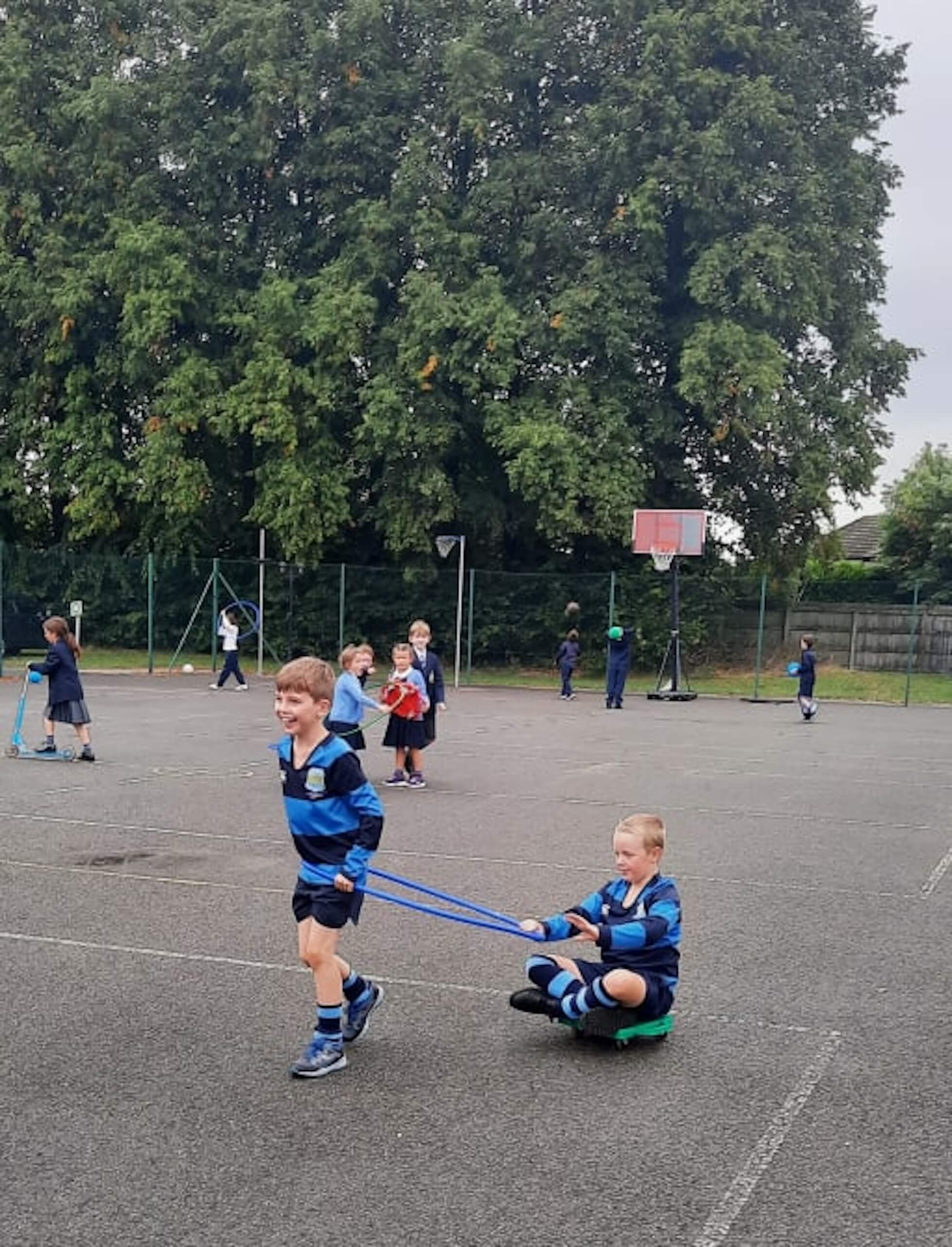 Two prep school students playing in the playground