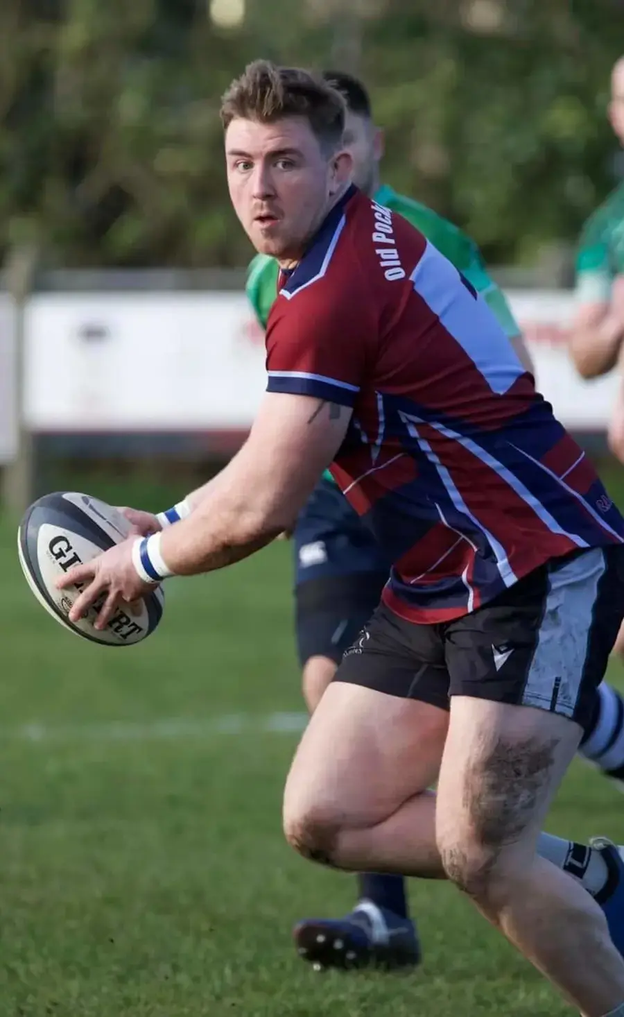 Old Pocklingtonian player holding the rugby ball during the Boxing Day rugby match