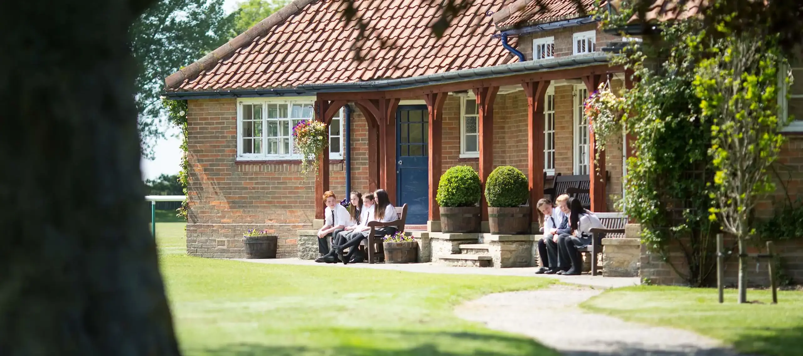 Pocklington School pupils outside the cricket pavilion 