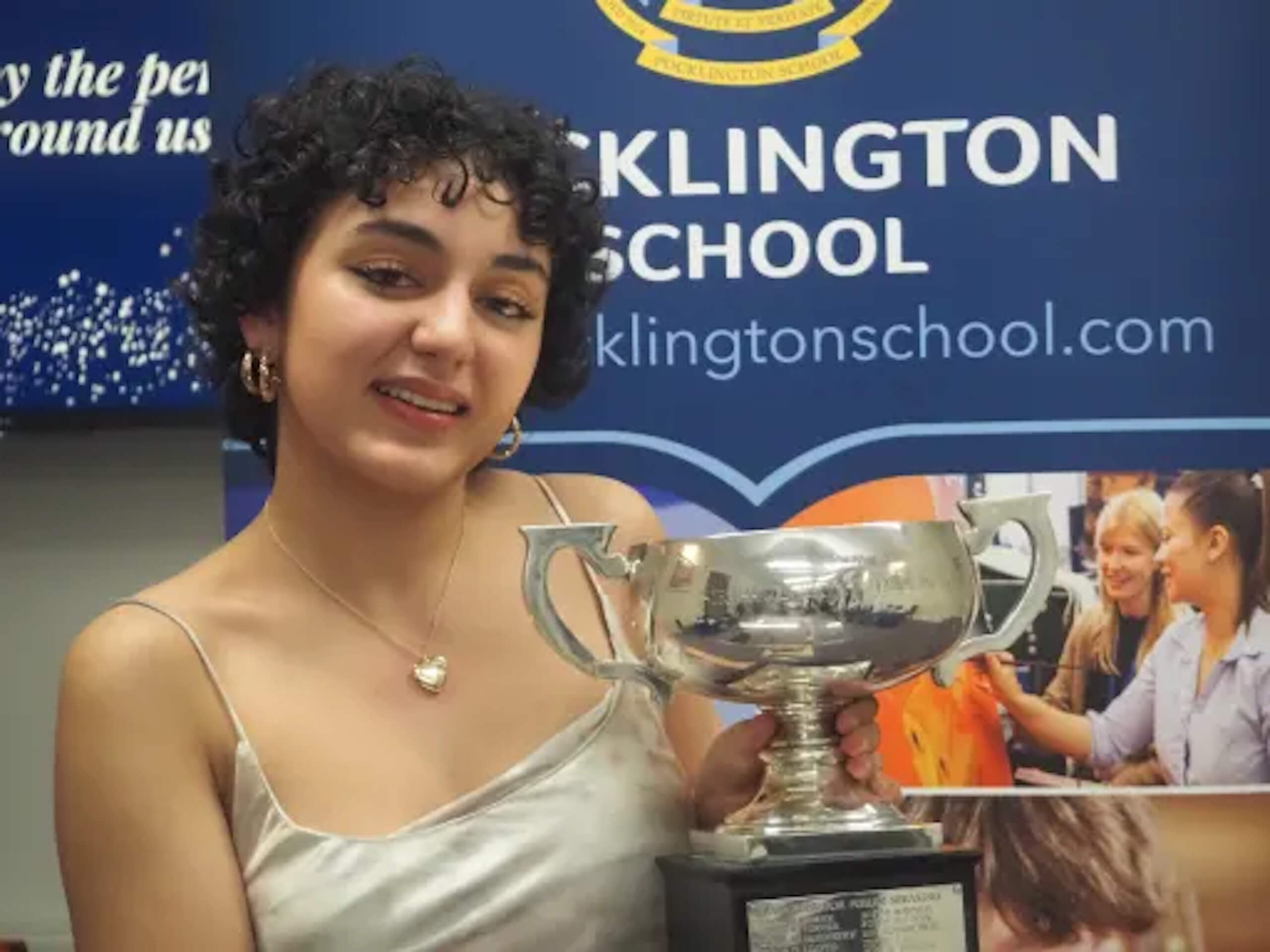 Pocklington Senior student holding an award