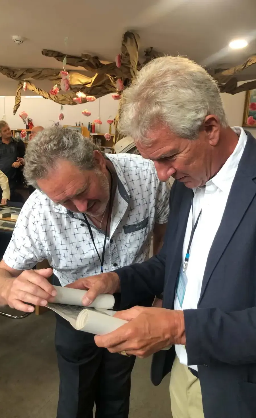 Two Old Pocklingtonians looking at archive material in the School Library